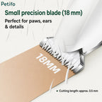A close-up view of the small 18mm precision blade on a pet trimmer cutting through short hairs with a 0.5mm cutting length.