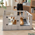 A cozy dog resting inside a stylish light wood pet enclosure with glass panels in a living room.
