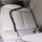 Black bungee-style Petifo pet seat belt resting on a beige leather car seat ready for use.