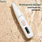 A white waterproof pet paw trimmer resting on a rippling water surface to highlight its wet-use capability.