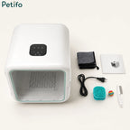 White automatic pet drying box with an open glass door for easy access.