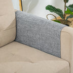 Grey textile section of the PawHut scratch protector over an armrest - Petifo