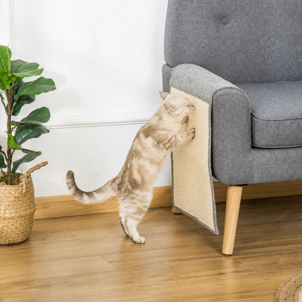 Cat using a PawHut sofa scratch protector on a grey armchair - Petifo